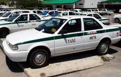 Cancun Taxis have a green stripe