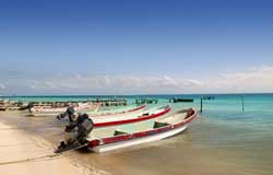 Puerto Morelos, Mexico - Fishing Boats on beach done for the day.