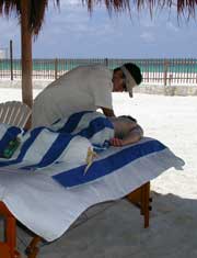 Guest of Playa Del Secreto, Mexico enjoy a massage on the beach
