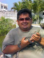 Secret Beach Villa Guest like to help Miguel feed his pet Coco a harmless crocodile that lives in the Cenote.